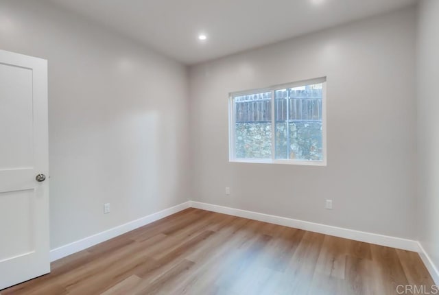 unfurnished room with light hardwood / wood-style floors