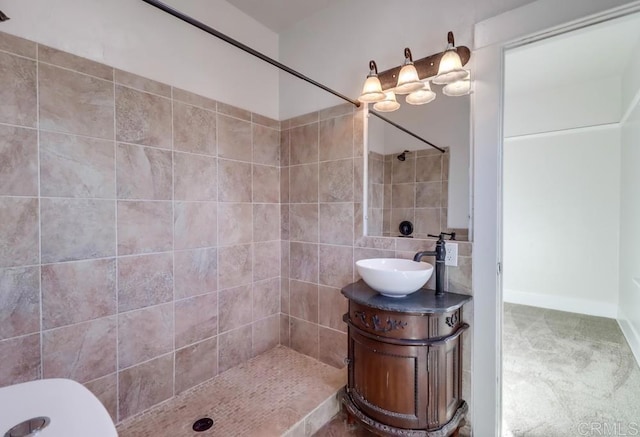 bathroom featuring vanity and tiled shower