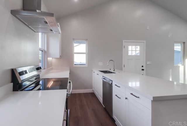 kitchen featuring high vaulted ceiling, white cabinetry, stainless steel appliances, and exhaust hood