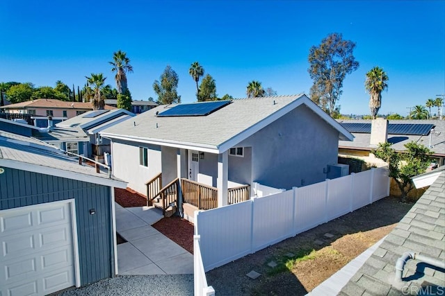 view of front of house with solar panels