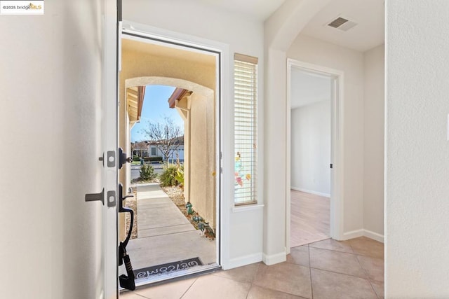 entryway featuring light tile patterned flooring