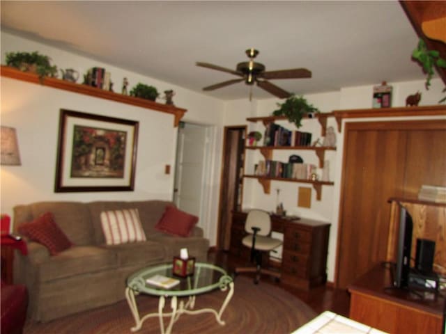 living room with ceiling fan