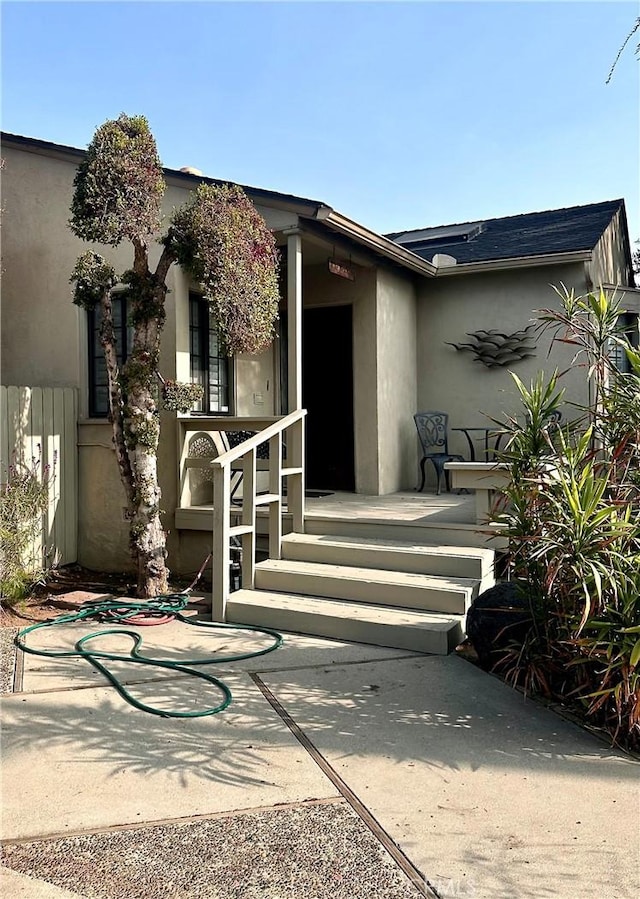 property entrance featuring a patio area