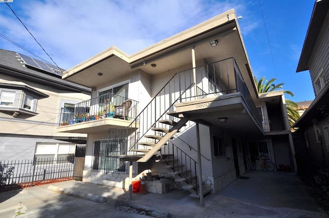 rear view of house with solar panels