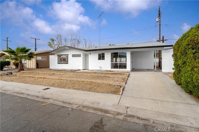 ranch-style house with a carport