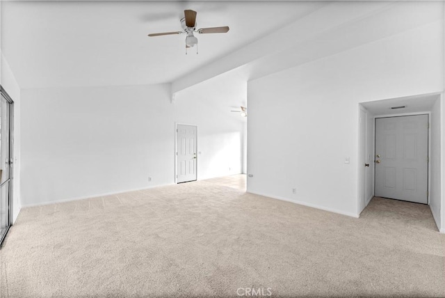 empty room with ceiling fan, light carpet, and vaulted ceiling with beams