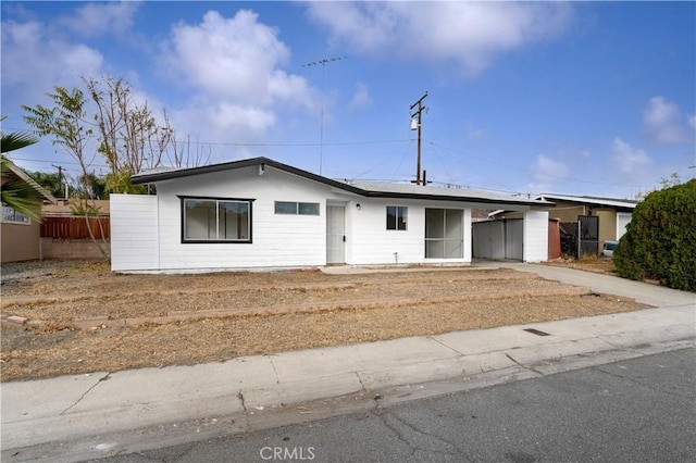 ranch-style house with a carport