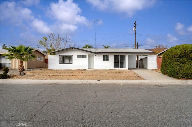 ranch-style house with a carport