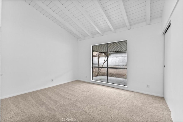 empty room featuring beamed ceiling, carpet floors, and high vaulted ceiling