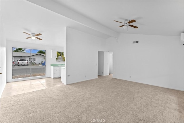 unfurnished living room with ceiling fan, light colored carpet, vaulted ceiling, and a wall mounted AC