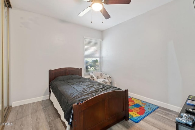 bedroom featuring ceiling fan and light wood-type flooring