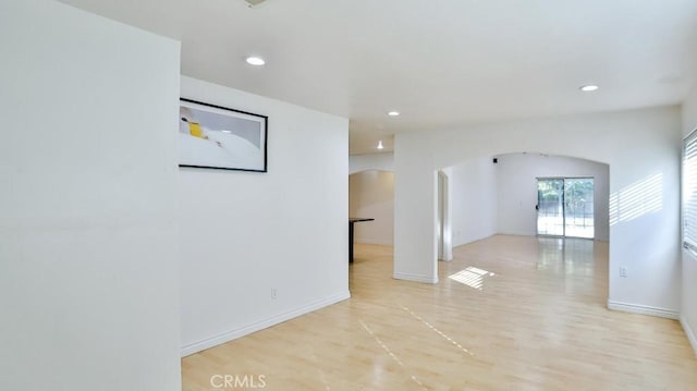 spare room featuring light wood-type flooring