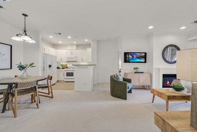 living room featuring light carpet and crown molding