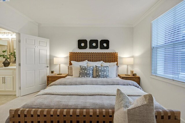 bedroom with light carpet and ornamental molding