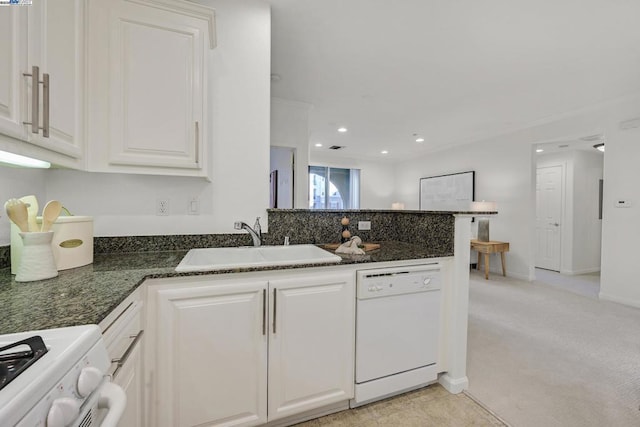 kitchen featuring white cabinetry, sink, white dishwasher, light colored carpet, and stove