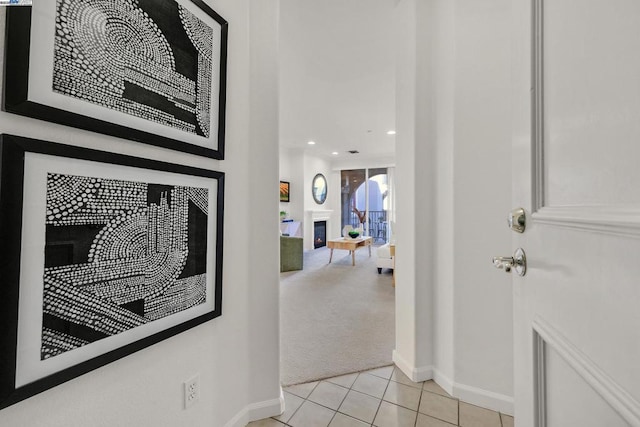 hall featuring light tile patterned flooring