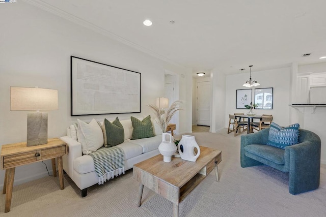 living room featuring light carpet, crown molding, and an inviting chandelier