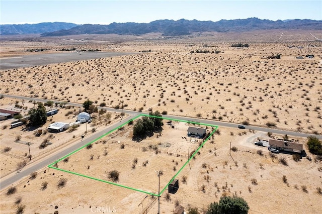 birds eye view of property with a mountain view