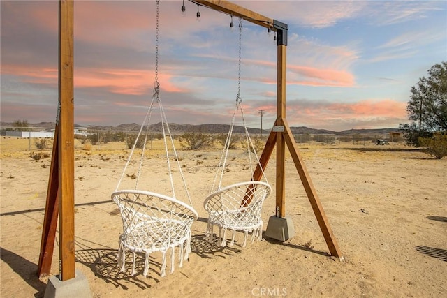 playground at dusk with a mountain view