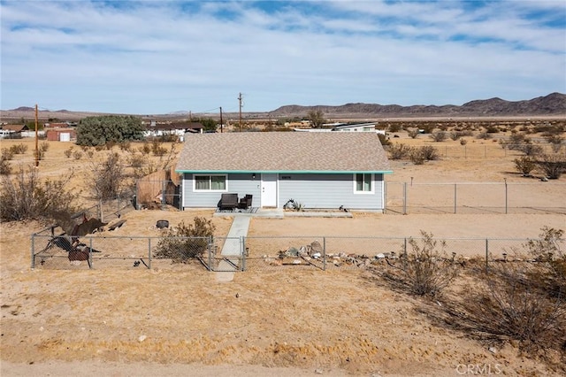 rear view of property featuring a mountain view