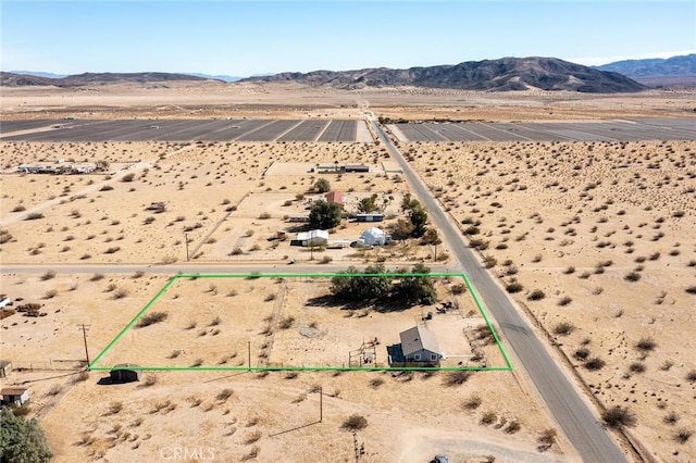 birds eye view of property featuring a mountain view