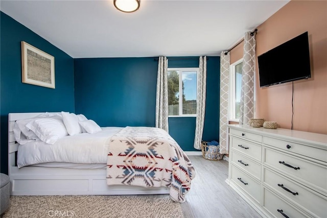 bedroom with light hardwood / wood-style flooring