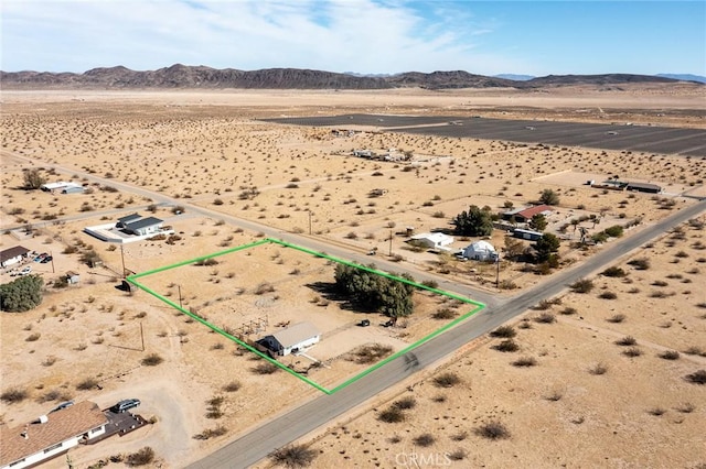 birds eye view of property with a mountain view