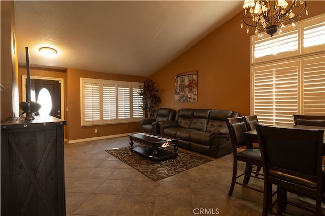 tiled living room featuring a textured ceiling, an inviting chandelier, and vaulted ceiling