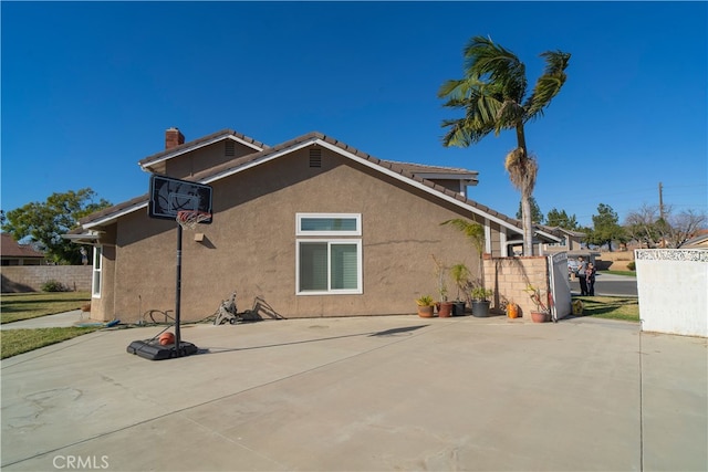 rear view of property featuring a patio area