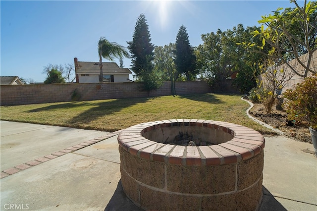 view of patio with a fire pit