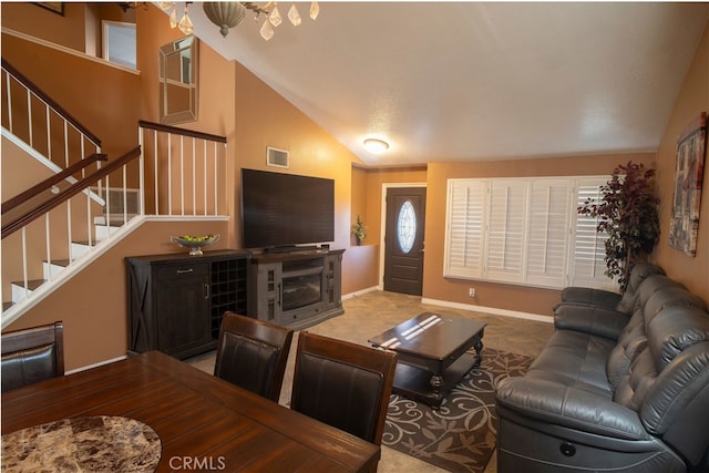 living room featuring lofted ceiling