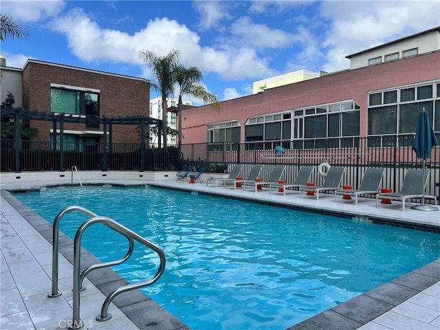 view of pool featuring a pergola and a patio