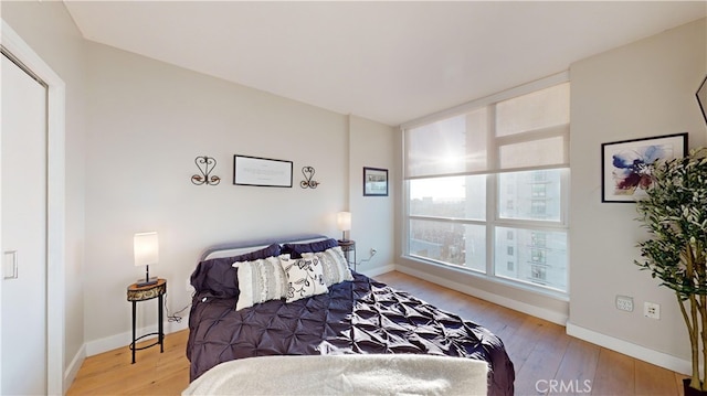 bedroom with light hardwood / wood-style floors