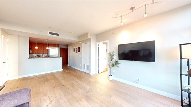 living room with light hardwood / wood-style floors