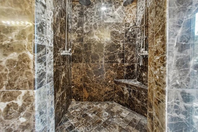 bathroom with a tile shower