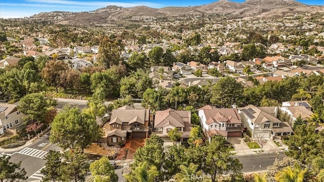 birds eye view of property with a mountain view