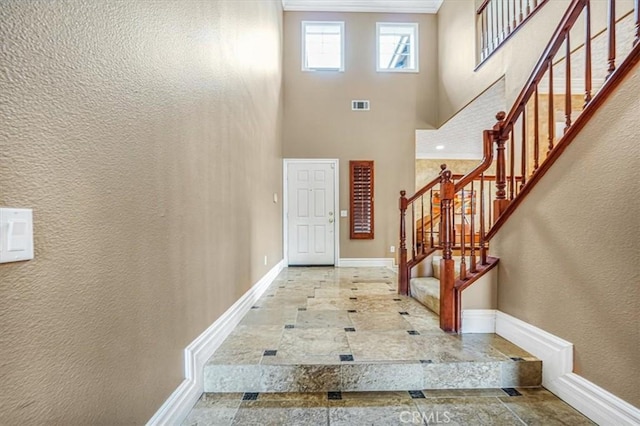 foyer featuring a high ceiling