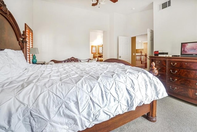 bedroom featuring ceiling fan and carpet