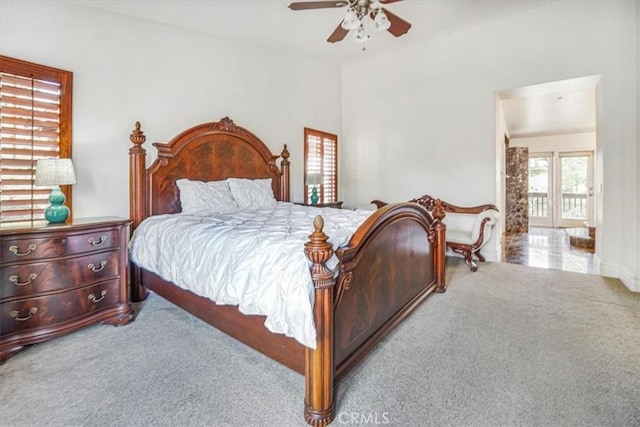 bedroom featuring ceiling fan and light colored carpet