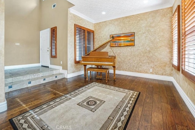 interior space featuring dark wood-type flooring and crown molding