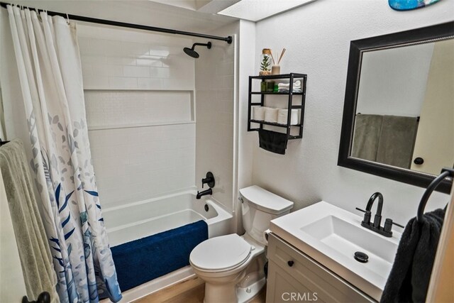 full bathroom with toilet, vanity, shower / tub combo with curtain, and hardwood / wood-style flooring