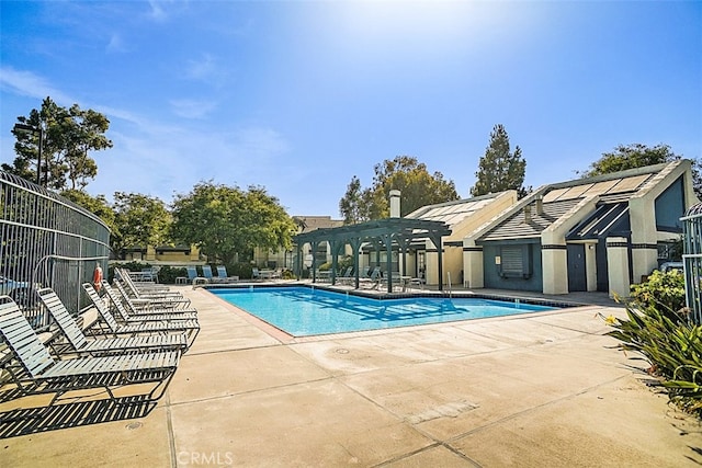 view of swimming pool featuring a patio and a pergola