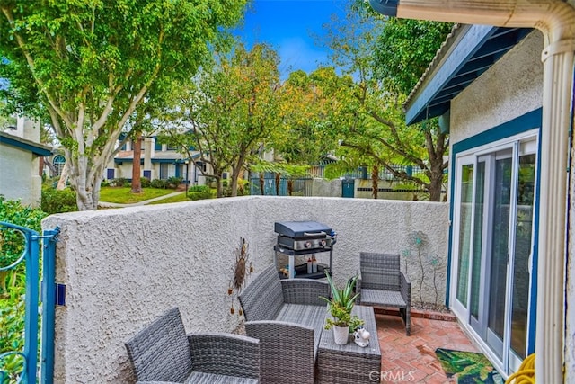 view of patio featuring a grill