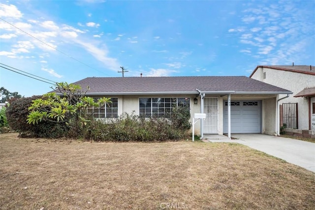 ranch-style house with a garage and a front yard