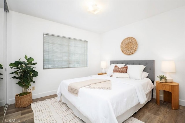 bedroom featuring wood-type flooring