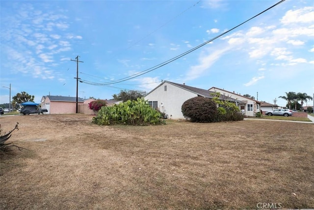 view of side of home featuring a lawn