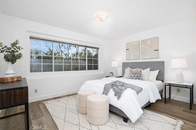 bedroom with wood-type flooring