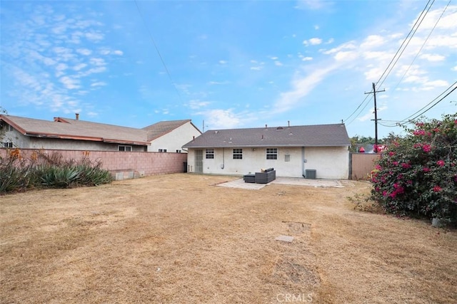 rear view of house with a patio area and central air condition unit