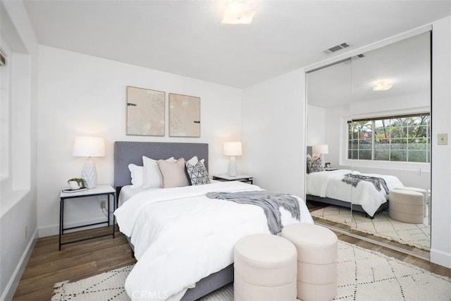 bedroom with hardwood / wood-style floors