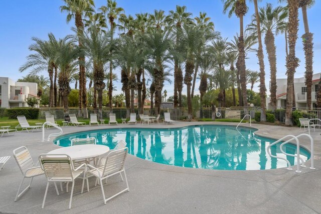 view of swimming pool featuring a patio